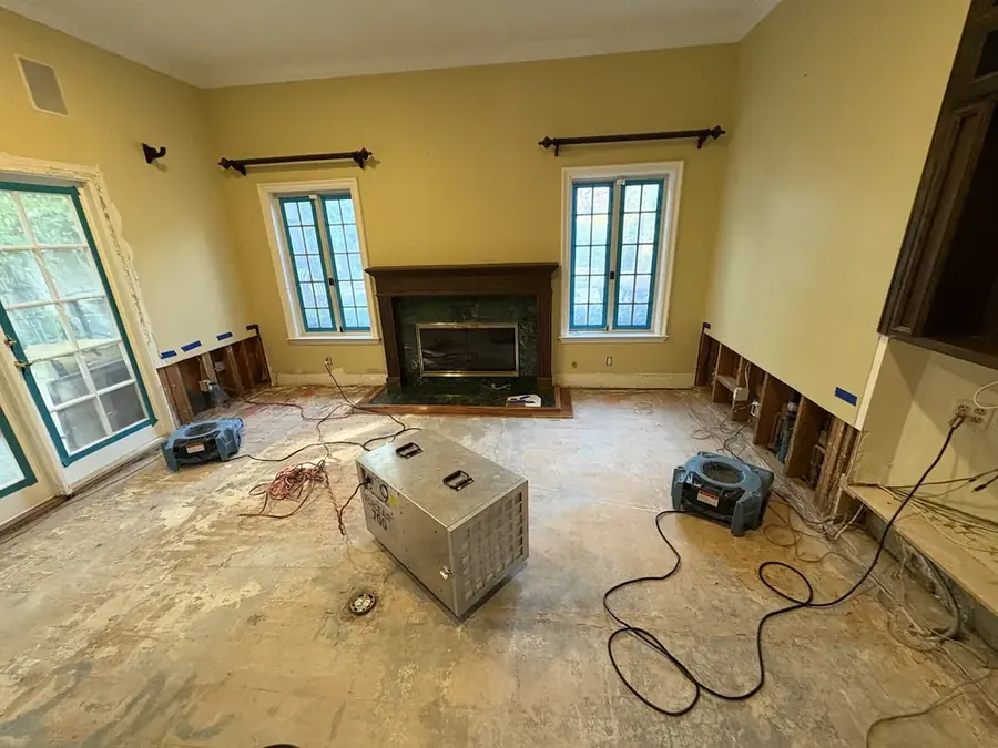 Technician setting containment in a Pasadena home
