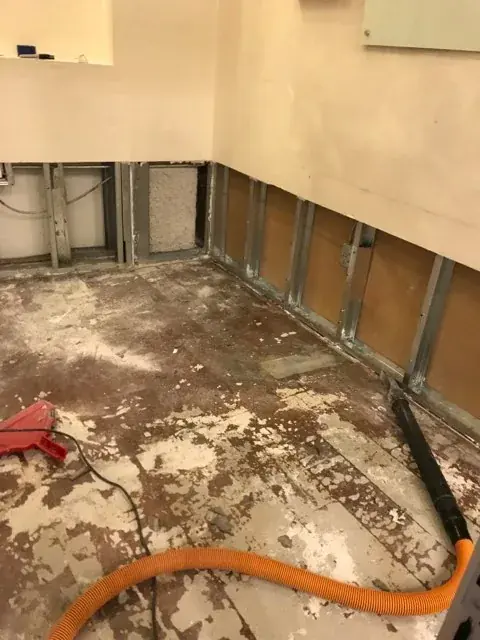 Wall opened and dried after a corroded pipe leak in an older Pasadena home